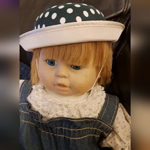 A formed polka dot hat, measuring 6 1/2inches across inside...